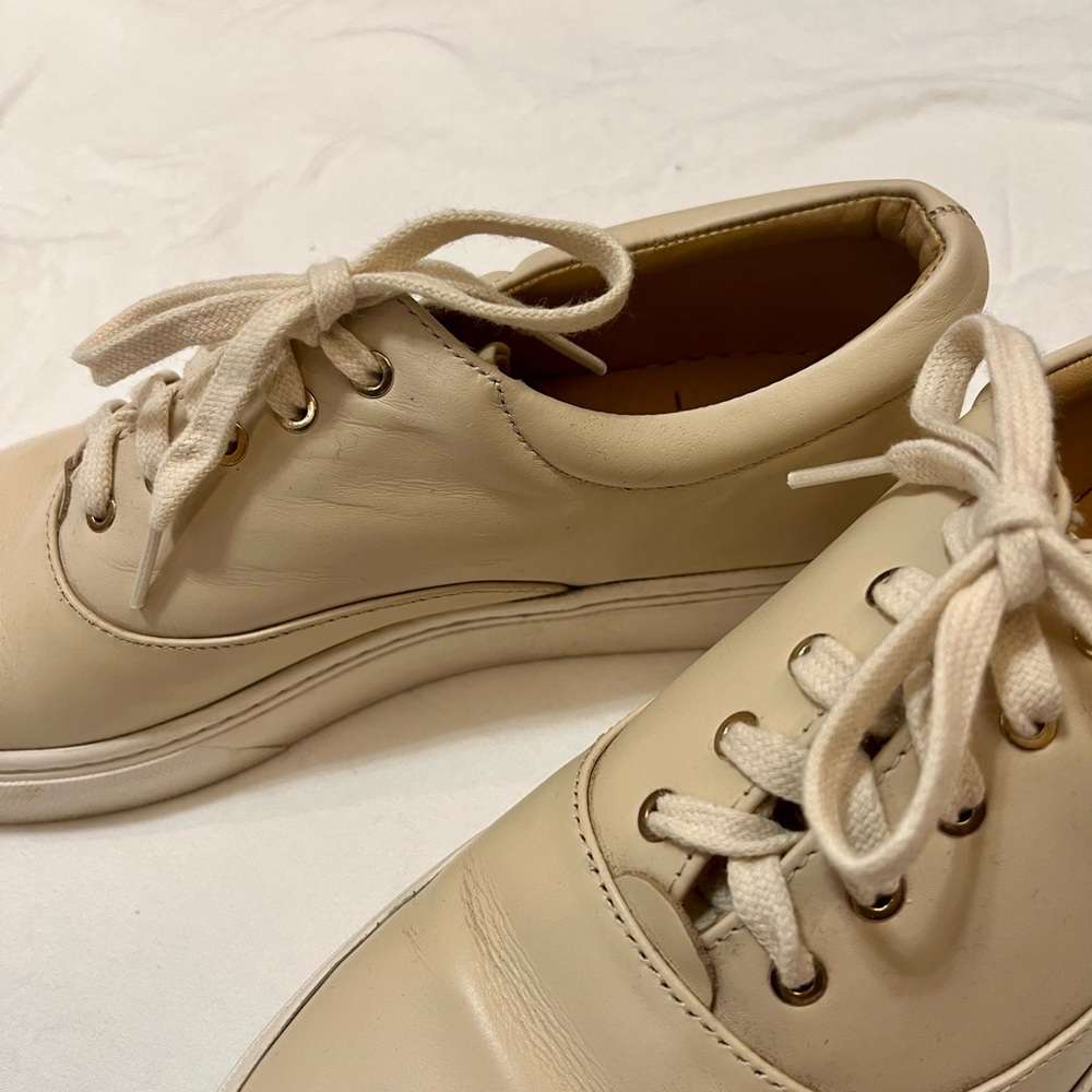 Nisolo tennis shoes. Lightly worn cream leather shoes..